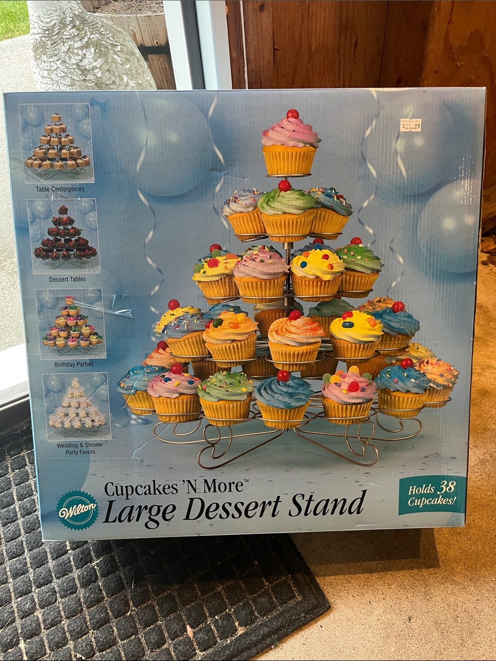 Wilton multi-tier cupcake stand with gold finish and colorful cupcakes